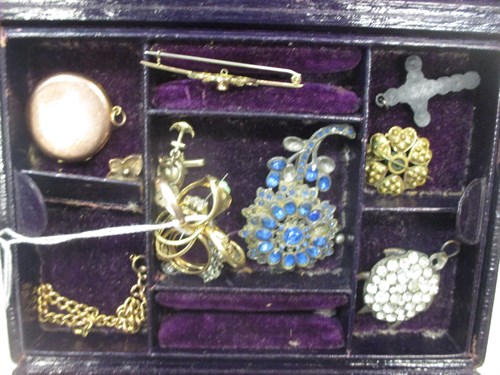 Lot 355 - A red leather jewellery case containing a...