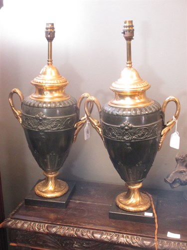 Lot 299 - A pair of neo-classical style lamps (2)