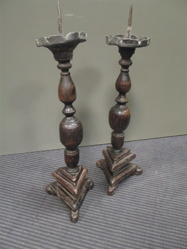 Lot 667 - A pair of wooden altar candle sticks (2)