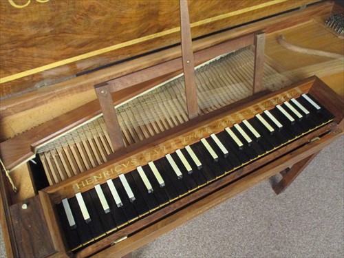 Lot 572 - A walnut cased 4 octave Clavichord by Henry Tull, dated 1932