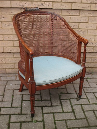 Lot 404 - An Edwardian painted satinwood bergere
