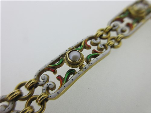 Lot 141 - An enamel and seed pearl bracelet
