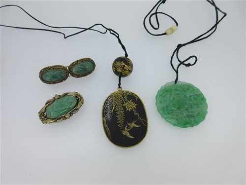 Lot 67 - An antique Japanese damascene work pendant together with some items jade jewellery