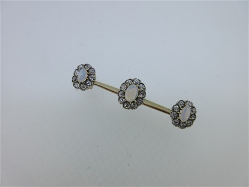 Lot 154 - An opal and diamond triple cluster bar brooch