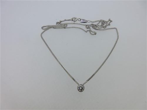 Lot 135 - A single stone diamond pendant with through chain set in 18ct white gold