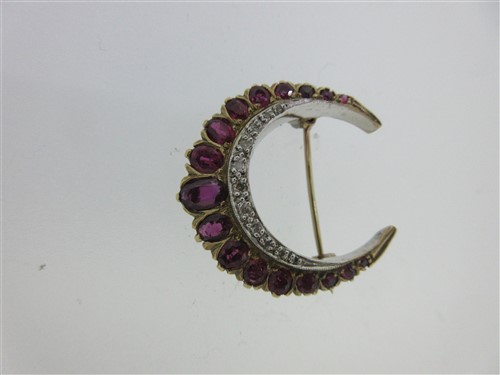 Lot 302 - A ruby and diamond crescent brooch