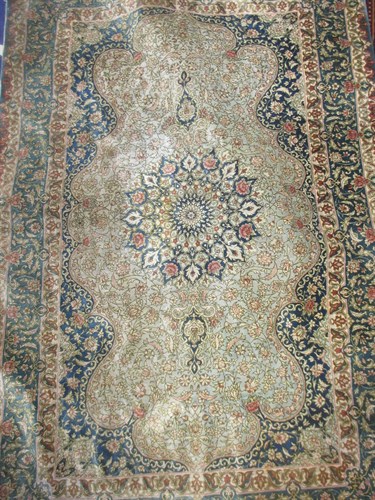 Lot 702 - A modern silk rug of green main ground 54 x...