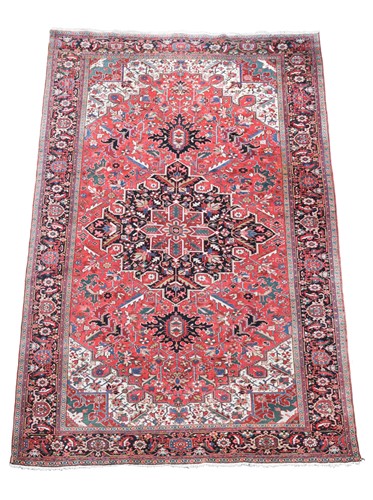 Lot 523 - An Herez red ground rug