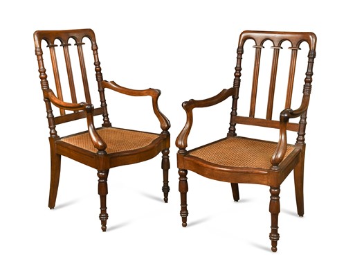 Lot 574 - A pair of 19th century colonial padouk rail back armchairs