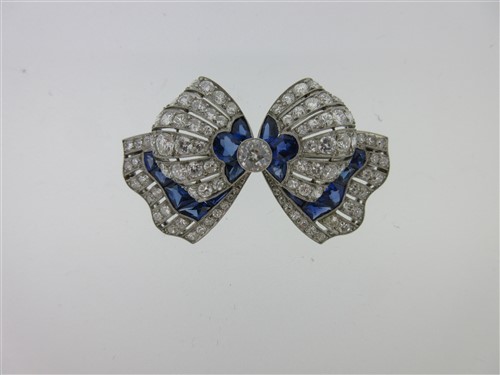 Lot 295 - An Art Deco sapphire and diamond bow brooch