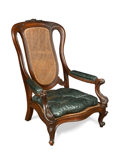 Lot 548 - An early Victorian library armchair with green leather squab seat