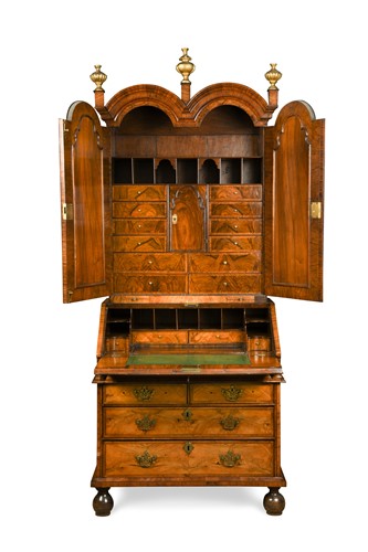 Lot 397 - A Queen Anne walnut double dome bureau bookcase