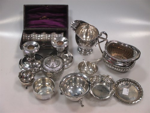 Lot 402 - A collection of silver including a cream jug,...