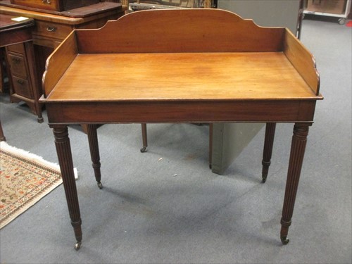 Lot 476 - A Regency mahogany galleried back wash stand...
