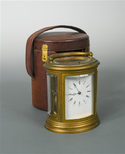 Lot 379 - A late Victorian oval brass repeating carriage clock