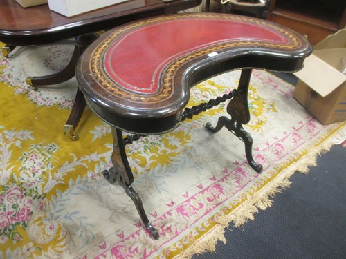 Lot 625 - A French marquetry inlaid kidney desk