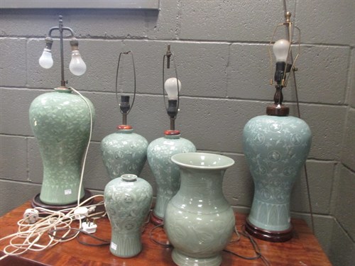 Lot 290 - Five Chinese celadon vases decorated with...