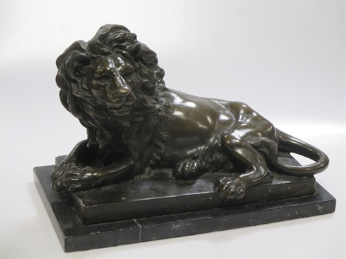 Lot 289 - After Barye, bronze figure of a recumbant lion...