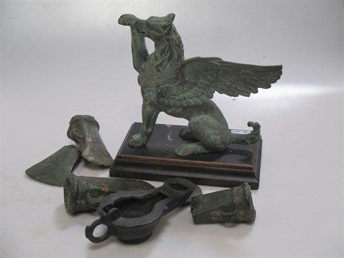 Lot 324 - Various ancient bronze axes, an oil lamp and...