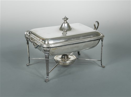 Lot 649 - An Edward VII silver entrée dish with a silver plated warming stand en suite