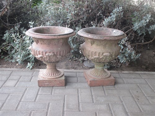 Lot 673 - A pair of terracotta garden urns 44cm high...