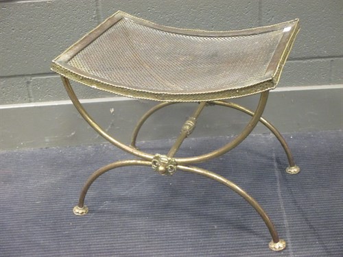 Lot 579 - A brass X framed stool