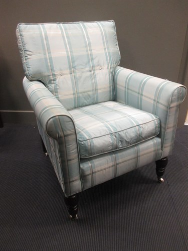 Lot 636 - A modern blue upholstered armchair on turned legs