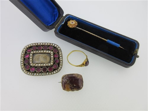 Lot 97 - A Georgian garnet and seed pearl brooch together with three other antique items of jewellery
