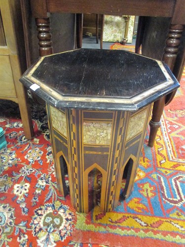 Lot 566 - An Indian ebonised and inlaid occasional table...