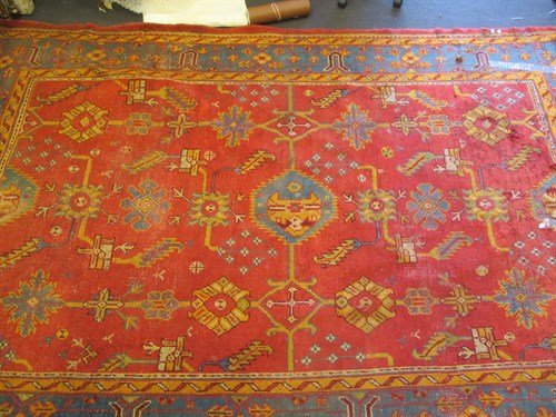 Lot 691 - An Ushak carpet, (worn, some damage) 350 x 240cm