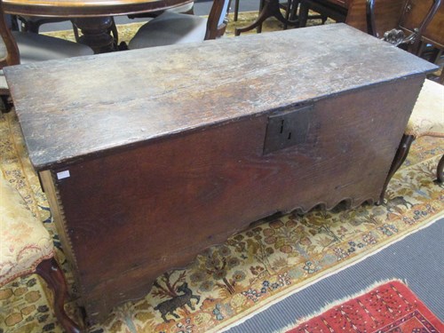 Lot 561 - A 17th century oak coffer with chip carved...