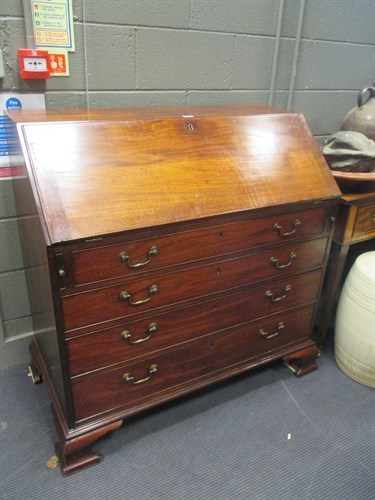 Lot 443 - A George III mahogany bureau with fitted...