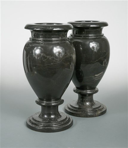 Lot 330 - A pair of turned black marble vases