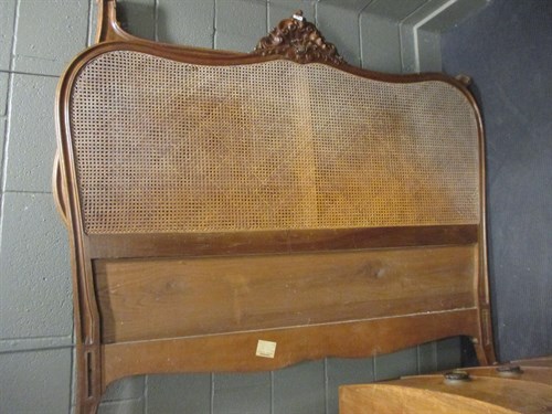 Lot 657 - A continental caned bed