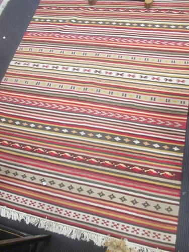 Lot 693 - A modern Ikea multicoloured striped Kelim 217...