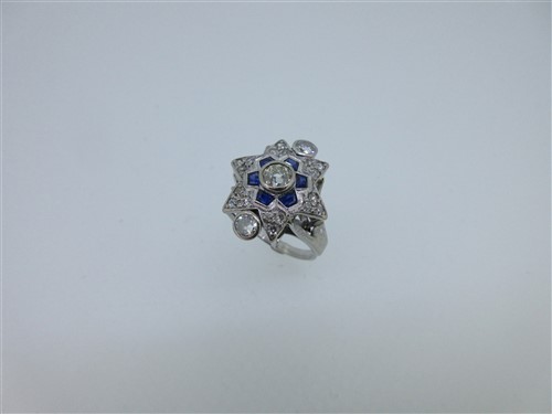 Lot 65 - A diamond and sapphire star ring