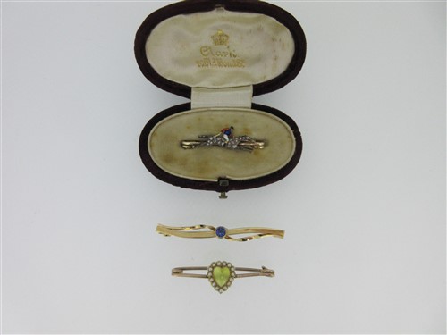 Lot 109 - A diamond and enamel racing horse tie pin and two other bar brooches