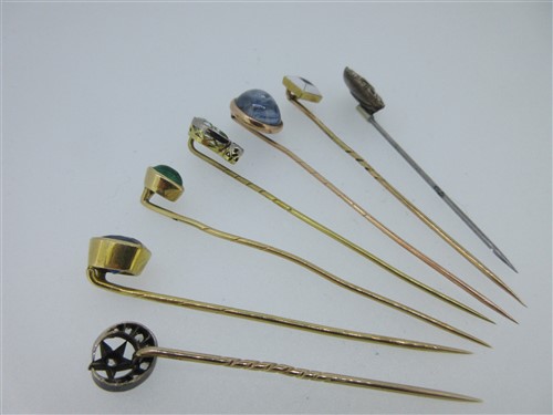 Lot 227 - A star sapphire stick pin and six others set with jewels