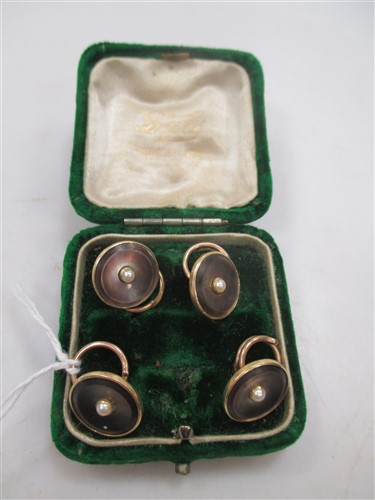 Lot 216 - A set of four mother of pearl and pearl dress buttons