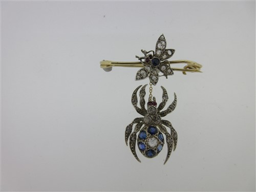 Lot 195 - A diamond and gem set spider and fly brooch