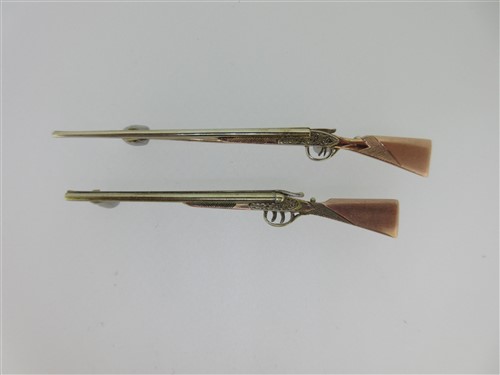 Lot 31 - Two tricolour gold double barrelled shotgun brooches