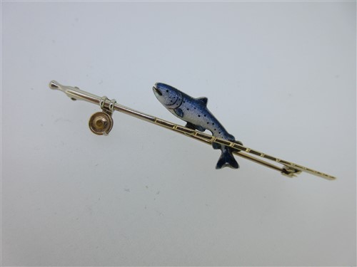 Lot 235 - An enamel salmon and fishing rod bar brooch