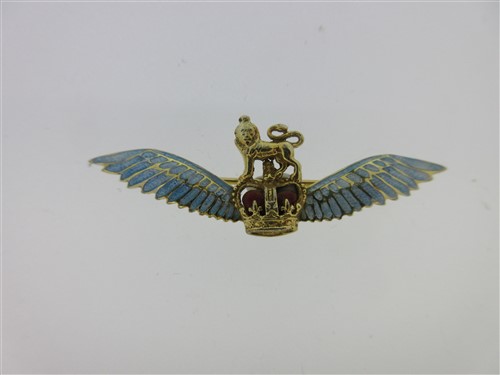 Lot 216 - An enamelled RAF wings brooch