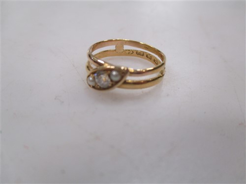 Lot 215 - A collection of four diamond set rings and a bar brooch set with a curling stone and broom