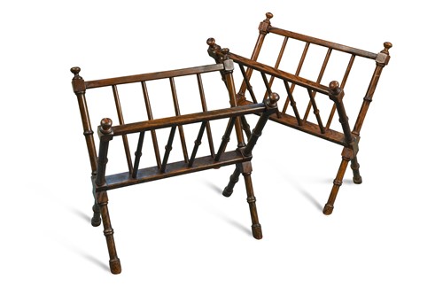 Lot 571 - A pair of Edwardian faux rosewood X framed magazine stands