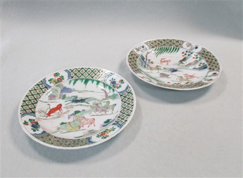 Lot 31 - A Pair of Chinese famille verte porcelain plates, Qing Dynasty, Kangxi (1662-1722)