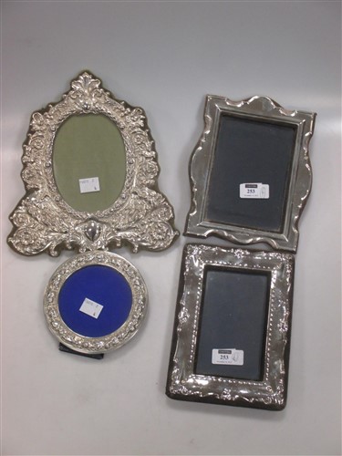 Lot 253 - A collection of 4 silver fronted photograph frames