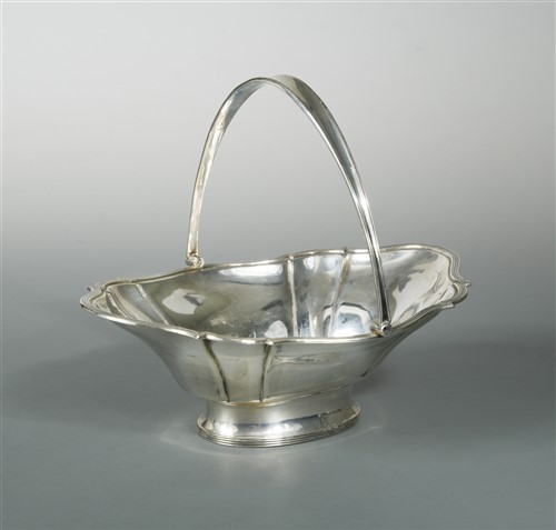 Lot 675 - A George V silver swing handled bread basket