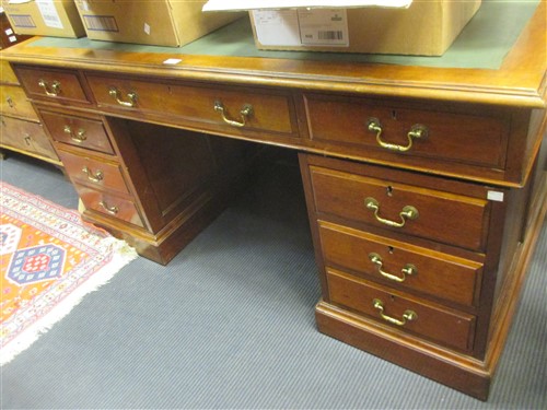 Lot 440 - An late Edwardian mahogany pedestal desk on a...