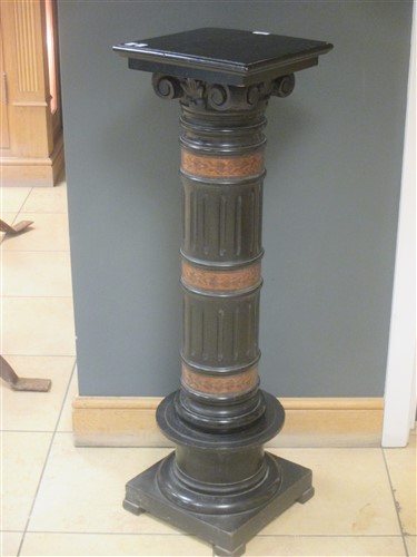 Lot 377 - An Aesthetic period ebonised column with...